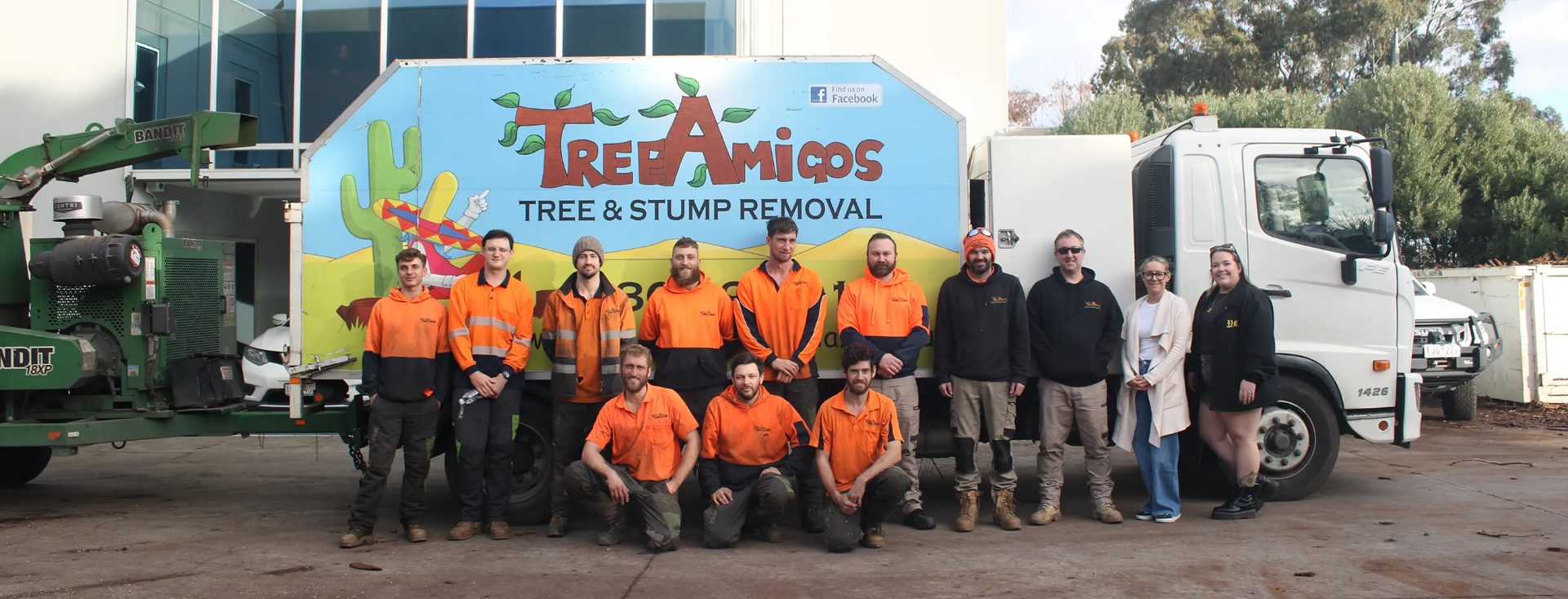 The Tree Amigos team in front of their truck and equipment